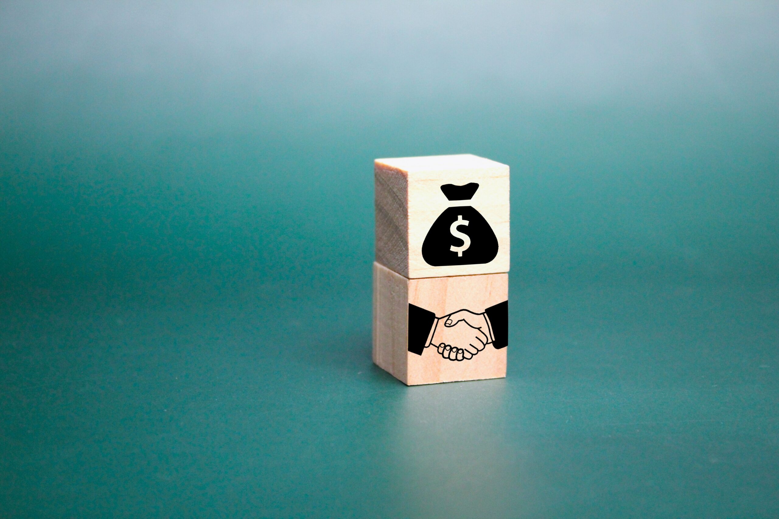 wooden cube with money icon and two party agreemen 2023 01 06 22 26 55 utc scaled