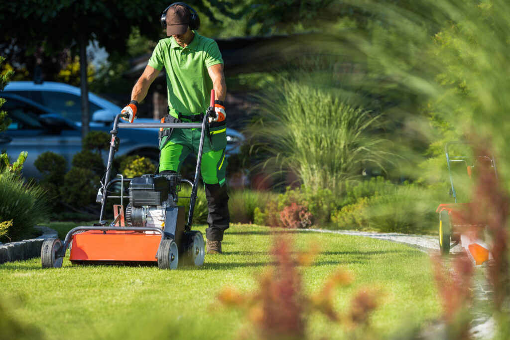 landscaper with scarifier machine taking care of a 2022 12 16 11 49 17 utc scaled