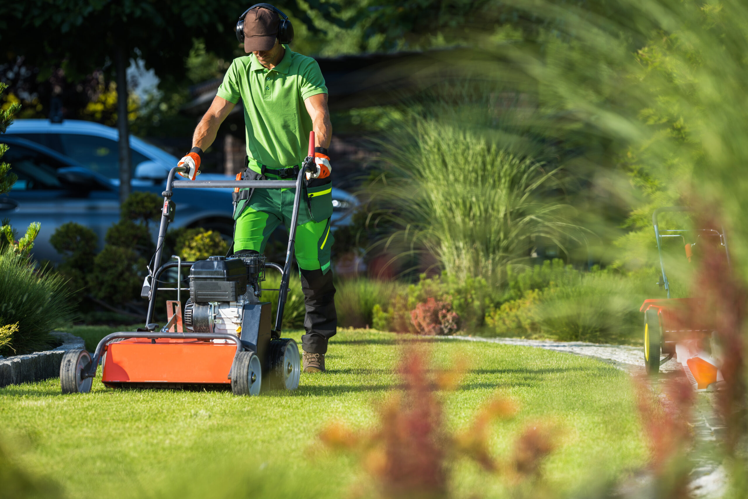landscaper with scarifier machine taking care of a 2022 12 16 11 49 17 utc scaled